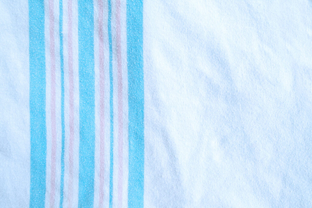 A hospital-style baby blanket stretched out.