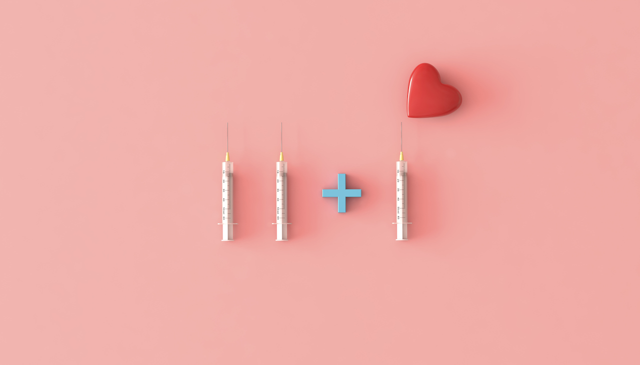 Three syringes are arranged on a pink background with a heart above the third.