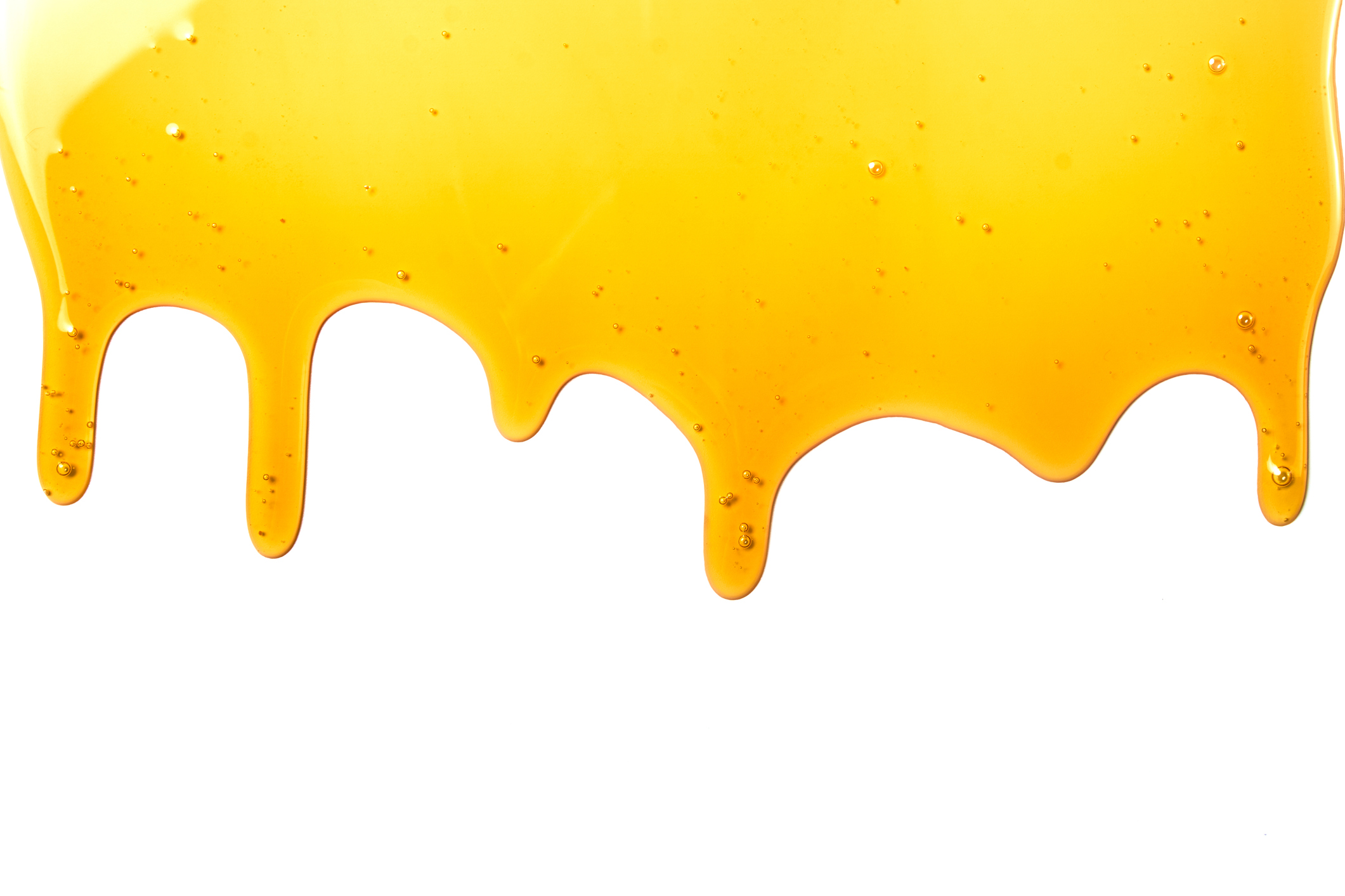 Sticky honey drips across a white background.