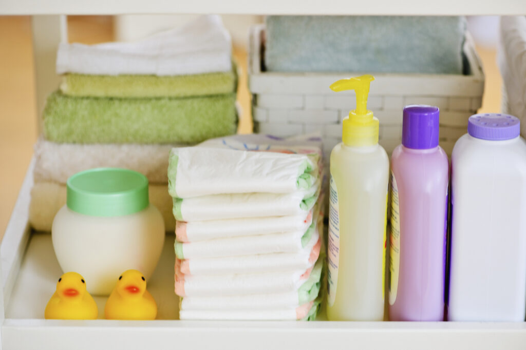 Stacks of diapers, cloths, rubber ducks, and other baby supplies.