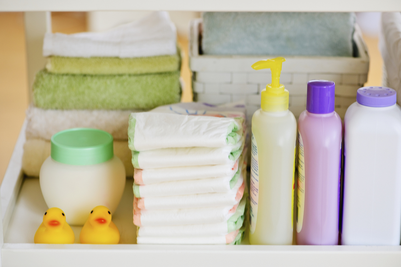 Stacks of diapers, cloths, rubber ducks, and other baby supplies.