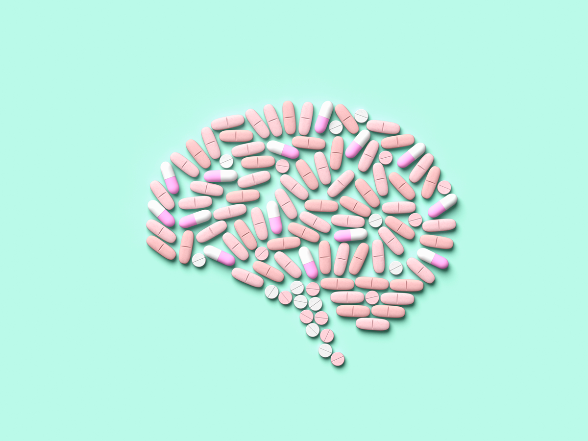 An illustration of a brain made of pills on a light blue background.