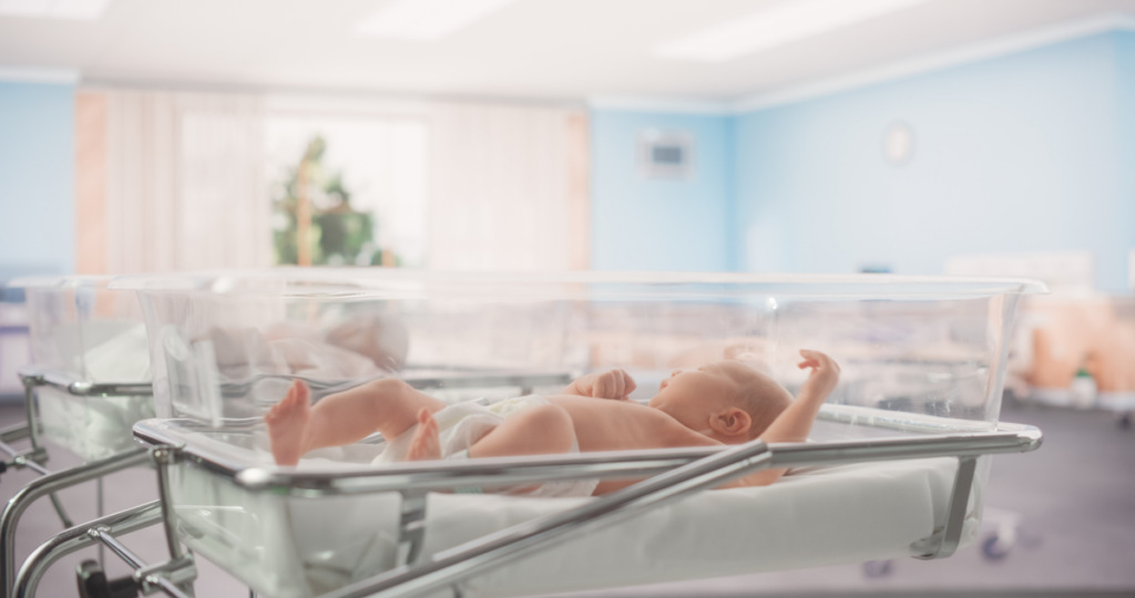 An image from a hospital nursery with several babies.