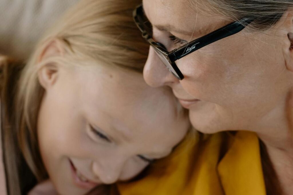 Child and grandparent embrace