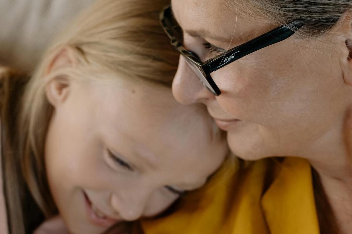 Child and grandparent embrace