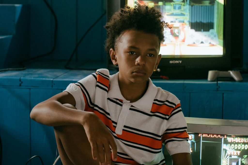 Frustrated looking boy in front of tv