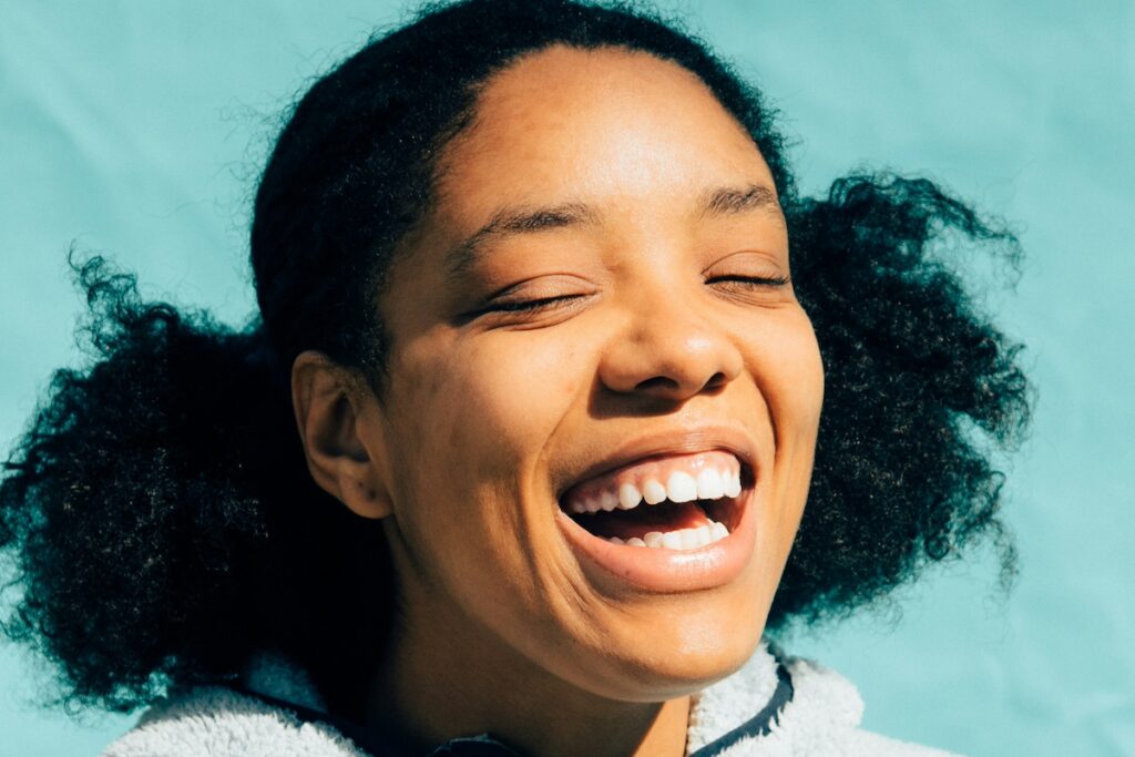 Person smiling on blue background
