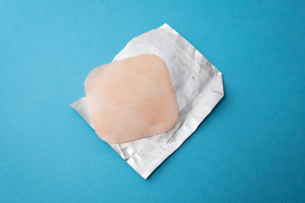 Progesterone patch on blue background
