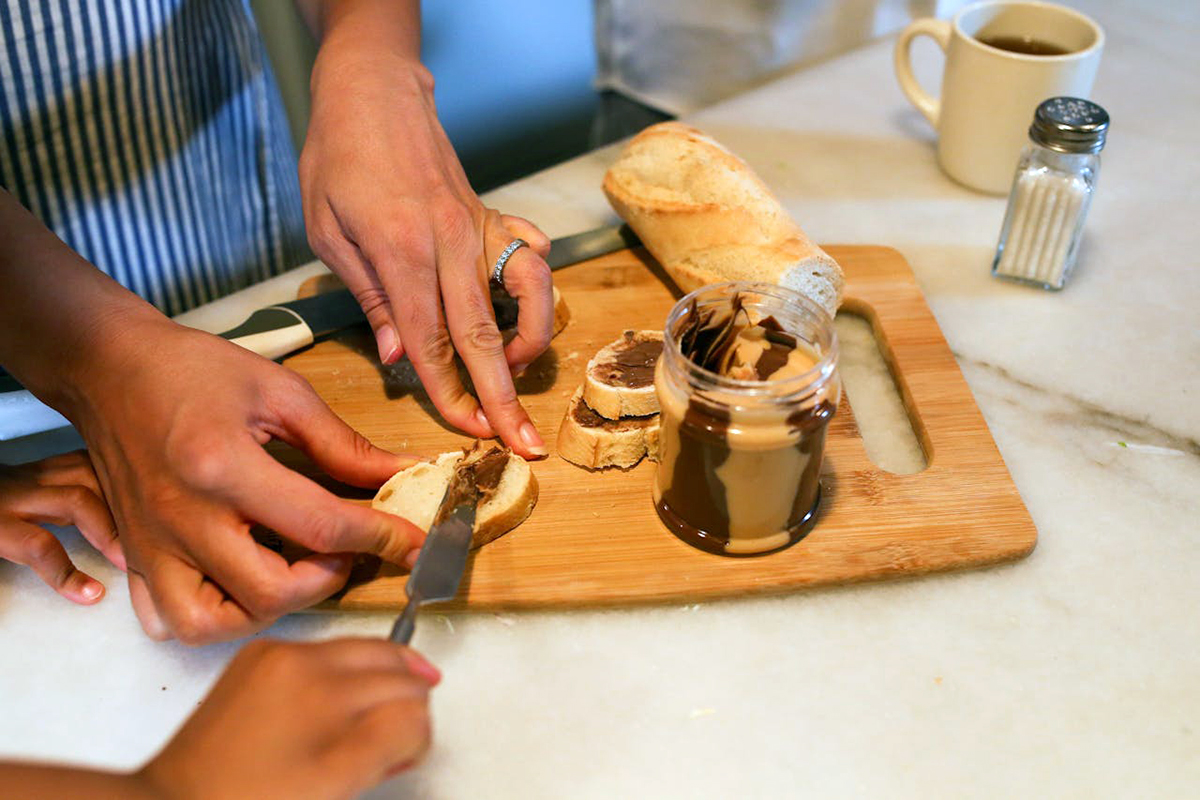 putting peanut butter on bread