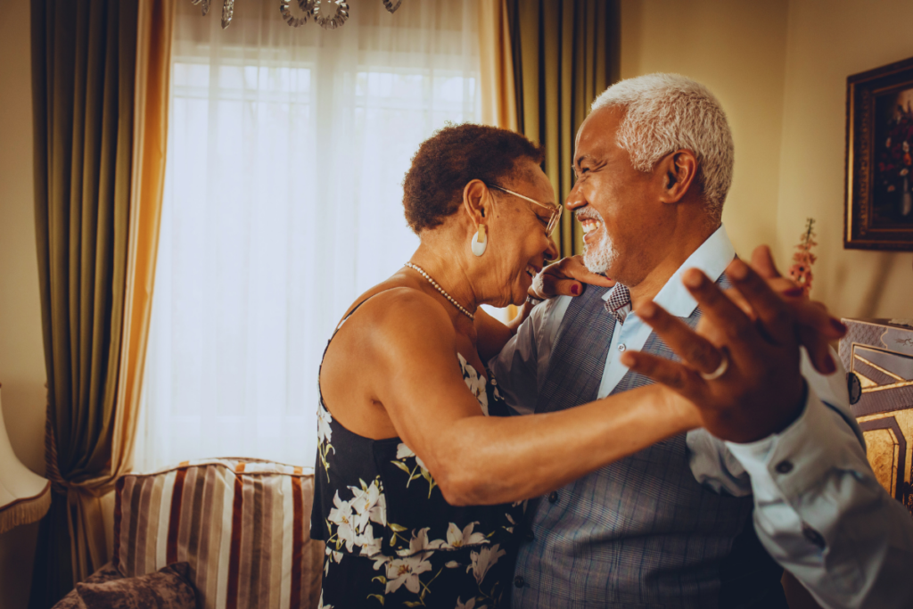 A couple dancing in the living room.
