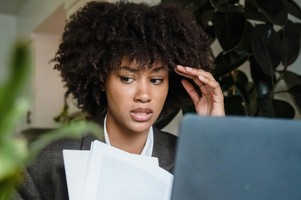 A person doing research and looking stressed.