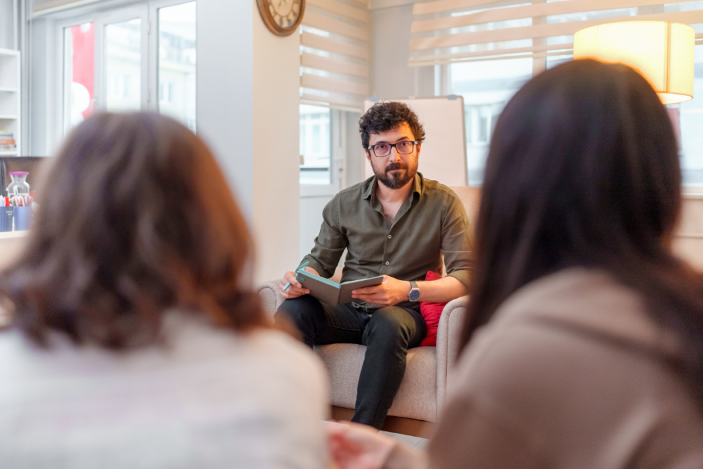 Two partners talking to another person