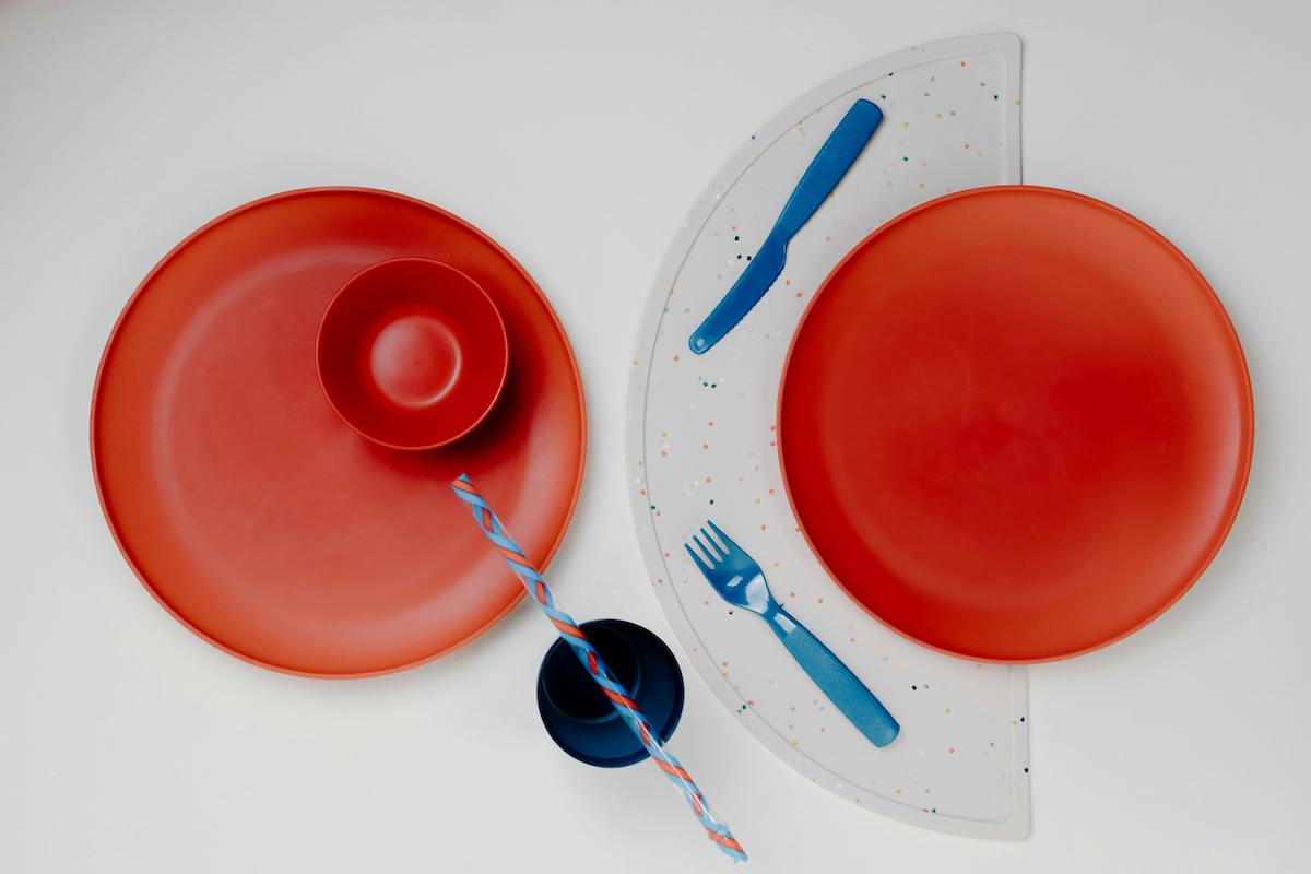 Two baby plates with baby cutlery