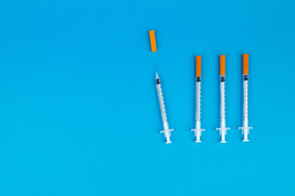 vaccines on blue background