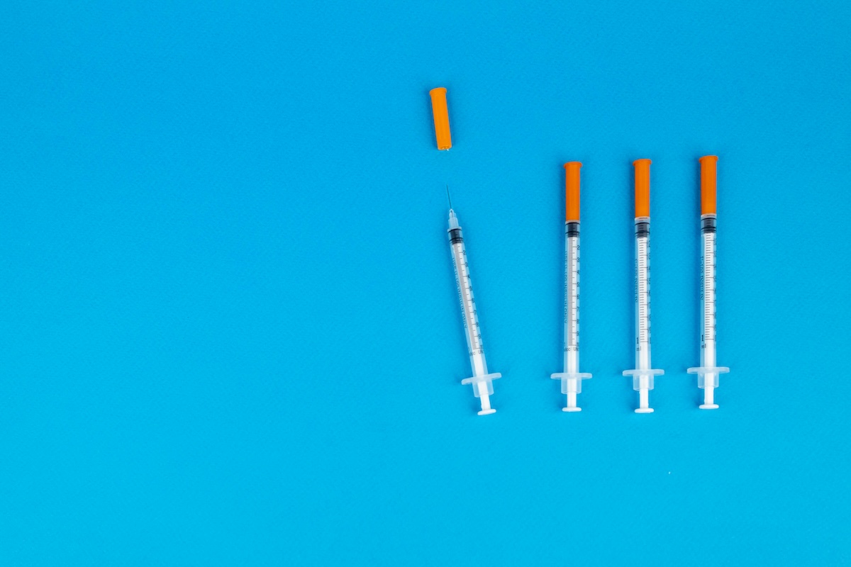 vaccines on blue background