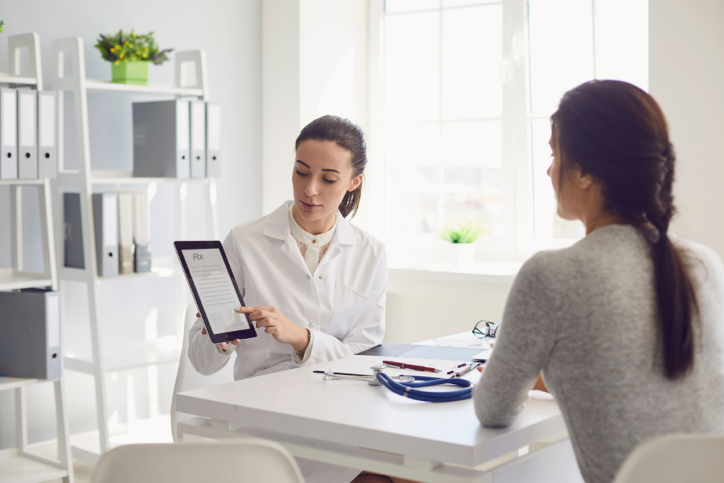 A doctor explaining a report to a patient in her office.
