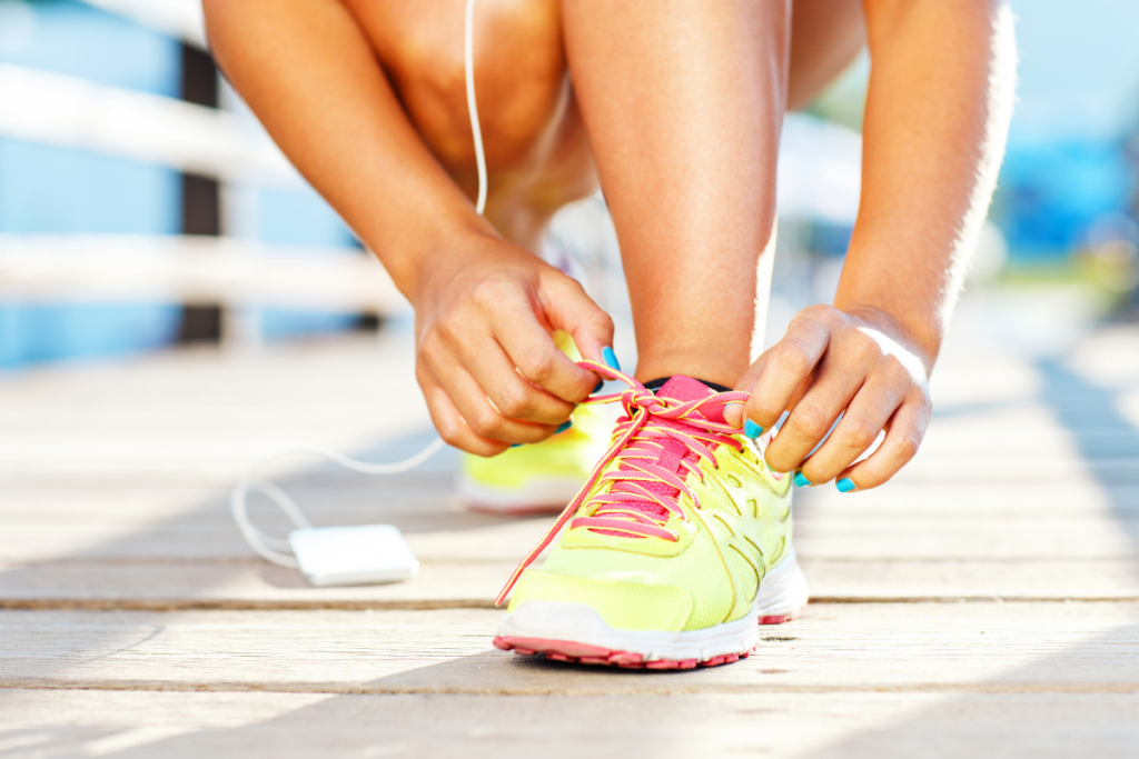 A person tying her shoes for running.