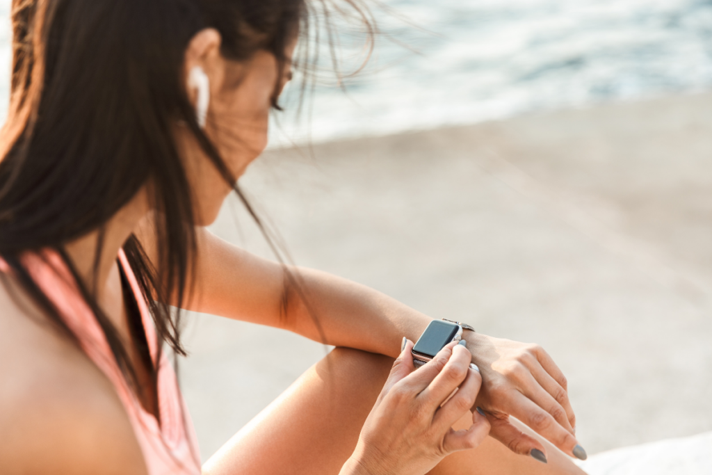A person lookin at her smart watch.