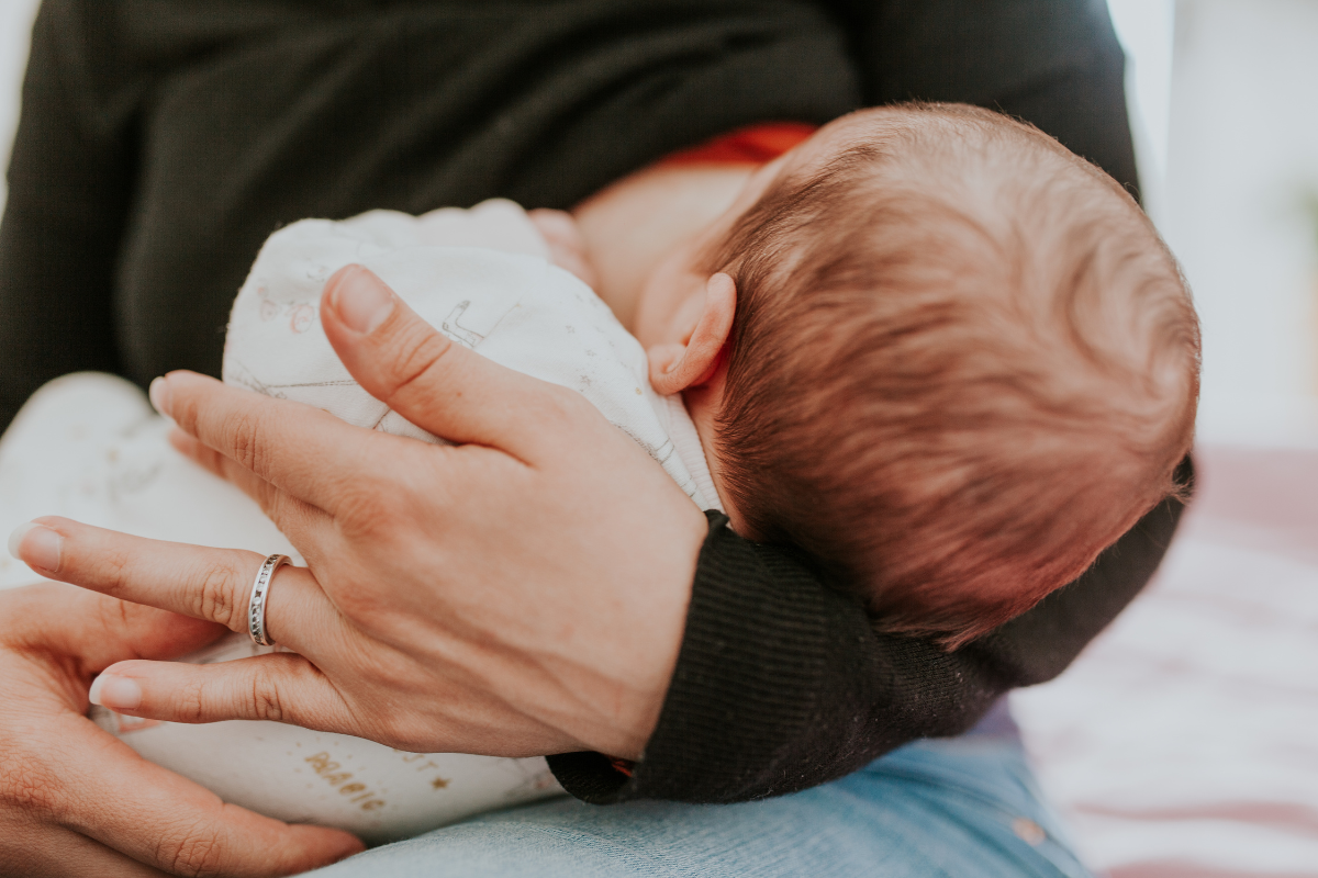 A baby being breastfed.