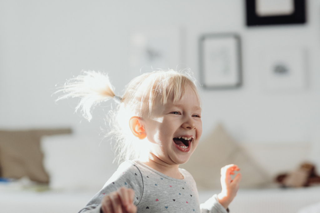 A toddler laughing.