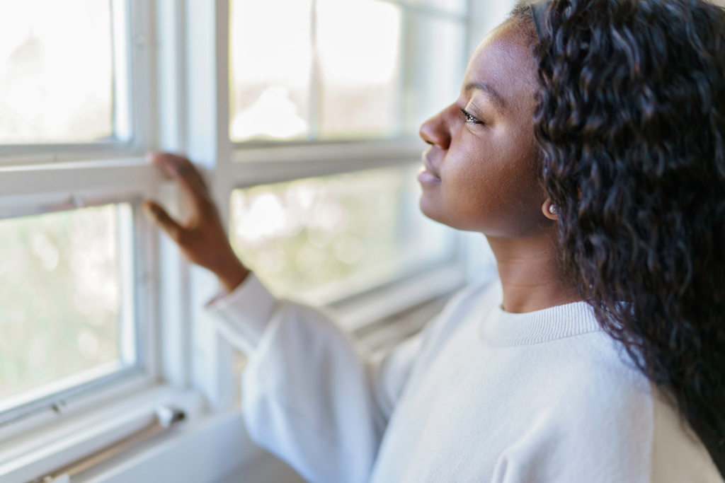 A person staring outside the window.